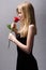 Romantic blond with red rose.