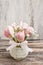 Romantic bouquet of pink tulips and gypsophilia paniculata