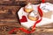 Romantic breakfast for Valentine`s Day. Two homemade cupcakes in the form of a heart, a red ribbon, a card with the inscription