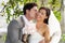 Romantic Bride And Groom Embracing Outdoors