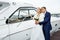 Romantic bride and groom on the pier with yacht