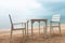 Romantic cafe with white table and chairs on the sea shore