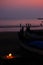 Romantic candle lit dinner on an beautiful evening pink sky on a cozy beach