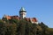 Romantic castle - fortress with tower in the forest. Smolenice castle, Congress Center of SAS - built in 15th century