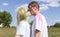 Romantic Caucasian Couple Adults Kiss With Colorful Paint, Powder On Clothes On Holi Color