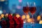 Romantic celebration wine glasses, roses, city lights for anniversary concept