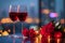 Romantic celebration wine glasses, roses, city lights for anniversary concept