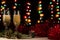 Romantic Christmas and New Year dinner of a couple in love with two glasses of champagne. Red tinsel and spruce branch with a cone