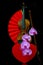 Romantic concept with violin, heart shape gift box, red folding fan and pink orchids 