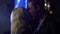 Romantic couple dancing and kissing tenderly on date at night club, relationship
