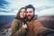 Romantic couple or friends show thumbs up and make selfie photo on travel hiking at Grand Canyon in Arizona