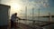 Romantic couple having date on embankment at sunset