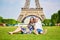 Romantic couple having near the Eiffel tower in Paris