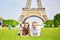 Romantic couple having near the Eiffel tower in Paris