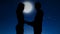 Romantic couple holding hands and kissing under starry night sky, relationships