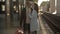 Romantic couple kissing and hugging in train station before separation