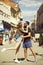 Romantic couple in love embrace, kiss and dance in street