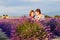 Romantic couple in love in lavender fields in