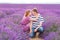 Romantic couple in love in lavender fields in Provence, France