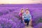 Romantic couple in love in lavender fields in Provence, France