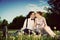 Romantic couple in love about to kiss sitting on grass. Vintage