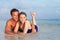 Romantic Couple Lying In Sea On Tropical Beach Holiday