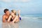 Romantic Couple Lying In Sea On Tropical Beach Holiday