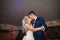 Romantic couple of newlyweds first elegant dance and kiss at wed