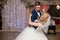Romantic couple of newlyweds first elegant dance at wedding reception hall