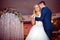 Romantic couple of newlyweds first elegant dance at wedding reception hall