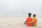 Romantic couple relaxing at beach on a sunny day