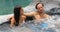 Romantic couple relaxing together in hot tub whirlpool jacuzzi luxury resort