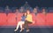 Romantic couple sitting in movie theater or cinema hall and hugging. Young man and woman watching film or motion picture