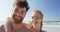 Romantic couple smiling at the beach 4k