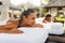 Romantic Couple Spa. People Relaxing, Enjoying Massage Outdoors