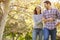 Romantic Couple Walking Through Autumn Woodland