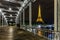 Romantic couple walking on the Debilly Bridge with the illuminated Eiffel Tower at Night