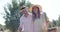 Romantic couple walking with wicker basket in olive farm 4k