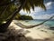 Romantic cozy hammock in the shade of a palm tree on a tropical beach by the sea