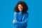 Romantic and cute, gorgeous african-american woman with afro haircut in winter lovely sweater, embracing own body and