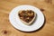 Romantic and cute heart shaped sweet pie couples breakfast on a wooden rustic counter and made with love