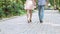 Romantic date of young man and woman, couple in love walking in summer park