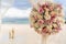 Romantic decoration with flowers of a beach wedding on the beach with sea in the background