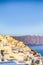 Romantic Destination. Tranquil Picturesque Cityscape of Oia Village on Santorini Island with Volcanic Caldera On Background