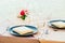 Romantic dining table setting with wine glass and other