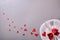 Romantic dinner decoration with many red hearts and gray