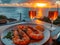 Romantic Dinner Overlooking Sunset at Beach with Grilled Shrimp and Wine Glasses