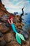 Romantic dreamer girl in mermaid costume on sea side
