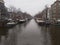 Romantic Dutch canals of Amsterdam on a gray day of winter haze