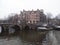 Romantic Dutch canals of Amsterdam on a gray day of winter haze